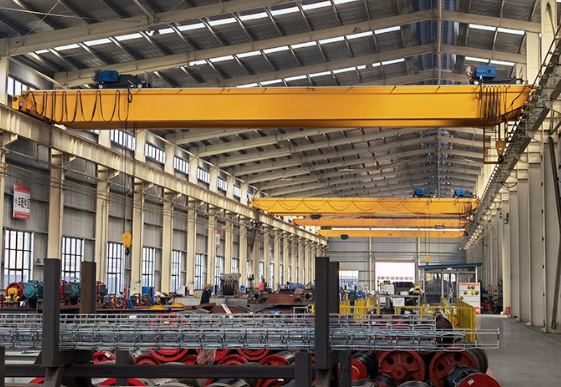 yellow overhead cranes in a warehouse